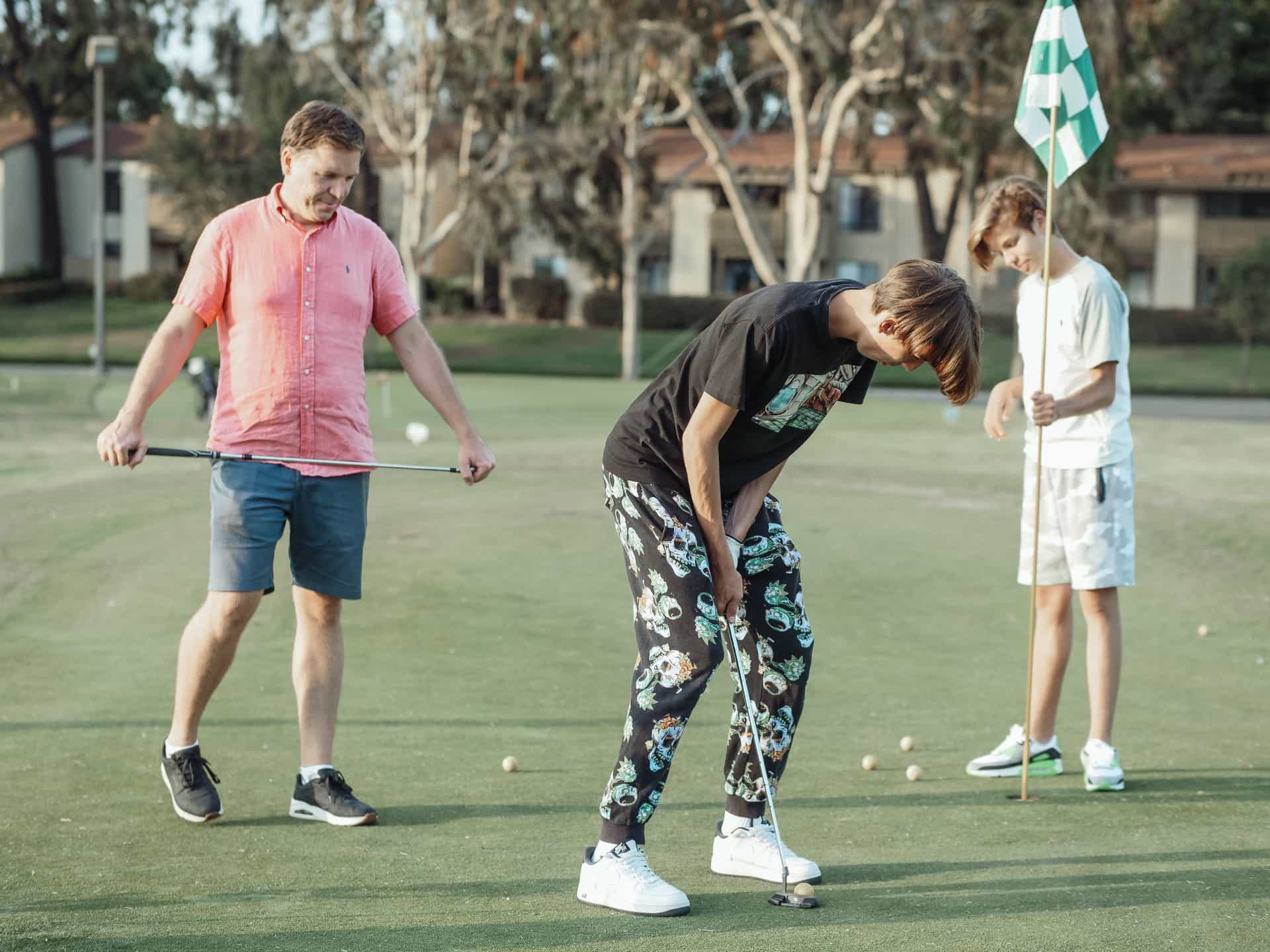A golfer walking a fairway